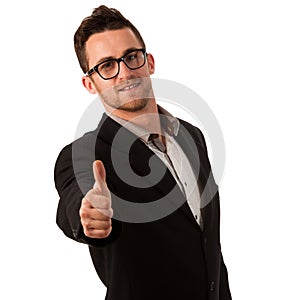 Confident businessman standing smiling with thumb up as a sign o