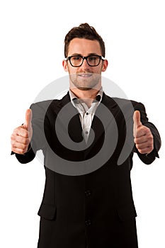 Confident businessman standing smiling with thumb up as a sign o