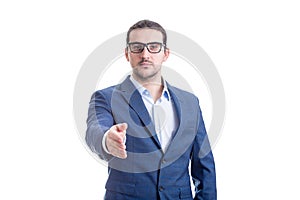 Confident businessman stretching hand for handshake greeting isolated on white background. Corporate person salute, boss hello