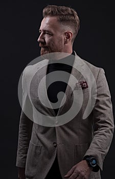 Confident businessman walking forward wearing a causal suit, handsome senior business man hero shot portrait  on