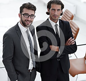 Confident businessmen standing together in office