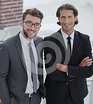 Confident businessmen standing together in office