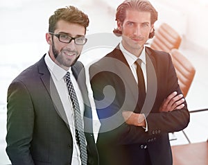 Confident businessmen standing together in office