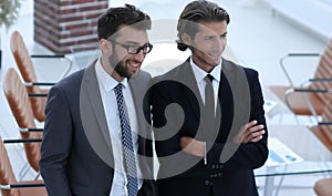 Confident businessmen standing together in office