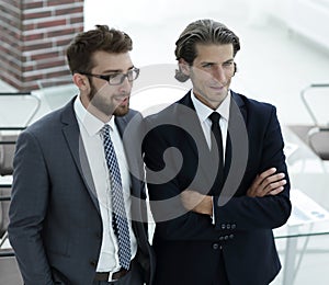 Confident businessmen standing together in office