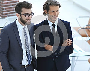 Confident businessmen standing together in office