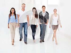 Confident businesspeople walking together