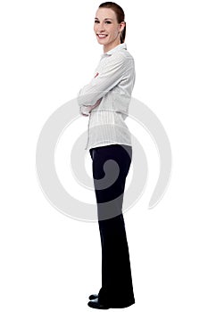 Confident businesswoman with folded arms