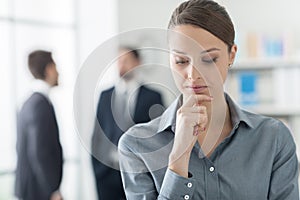 Confident businesswoman with hand on chin