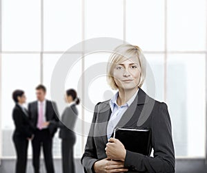 Confident businesswoman in office lobby