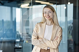 Confident businesswoman smiling in modern office setting