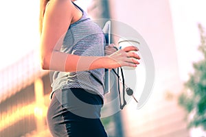 Confident businesswoman walking to work in city. Office worker, student, realtor or lawyer with coffee cup. Career woman.