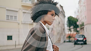 Businesswoman walking city street hurry on meeting close up. Woman crossing road