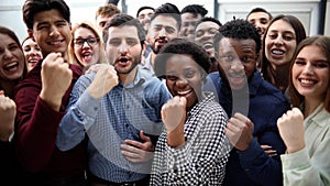 Confident diverse college students show fist up.