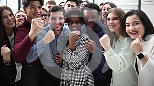 Confident diverse college students show fist up.