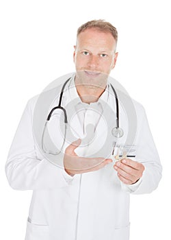 Confident Doctor Holding Modern Hearing Aid Device
