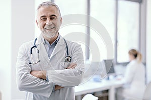 Confident doctor posing with arms crossed