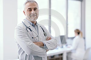 Confident doctor posing with arms crossed