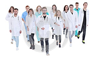 Confident doctor standing in front of a group of medical professionals