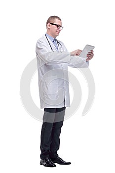 Confident doctor using digital tablet. Isolated on white background