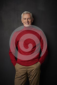 Confident elderly man studio portrait