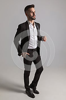 Confident elegant man holding hand in pocket