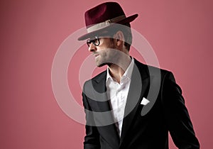 Confident elegant man looking away while wearing tuxedo