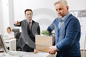 Confident employer firing the employee from the company