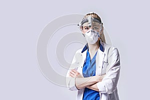 Confident ENT doctor wearing surgical headlight head lantern, protective face mask and glasses. Portrait of female