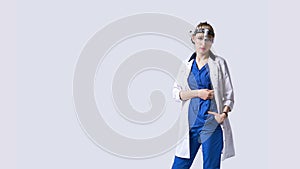 Confident ENT doctor wearing surgical headlight head light and protective glasses. Portrait of female otolaryngologist