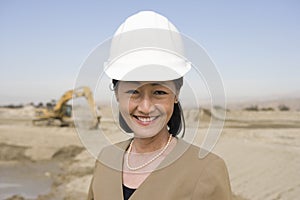 Confident Female Architect At Construction Site