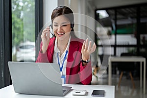 A confident female call center agent is giving advice to a customer over the phone or video call