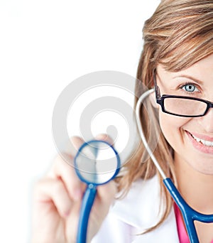 Confident female doctor holding a stethoscope