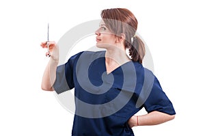 Confident female doctor holding syringe with anesthetic photo