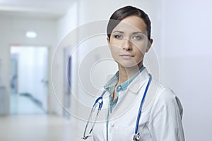 Confident female doctor with lab coat
