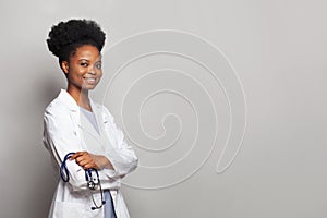 Confident female doctor medical professional smiling on white background