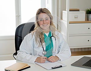 Confident female doctor working on medical consultation on laptop at hospital or clinic office