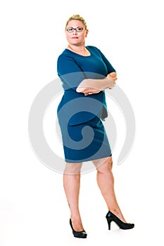 Confident female executive in blue dress on white