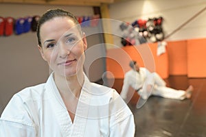Confident female in gym in martial arts training