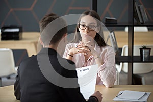 Confident female job applicant waiting for recruiter decision du