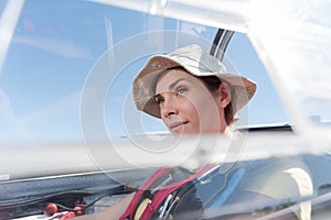 confident female pilot in private jet