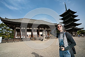 A confident female tourist flicks her hair