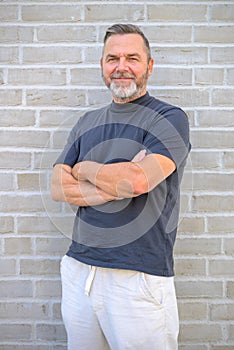 Confident friendly middle aged man in trendy leisurewear