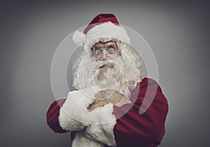 Confident funny santa posing with arms crossed