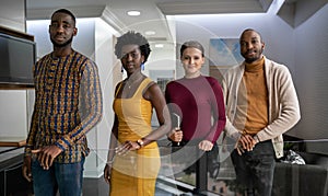 Confident group of diverse young businesspeople standing in an office