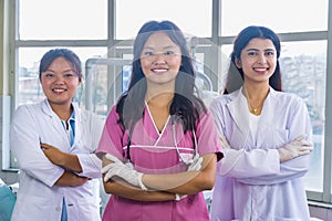 Confident Group of Nepali Indian Nurse and Doctors Smiling with hands crossed