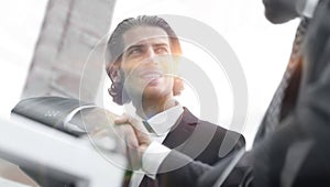 Confident handshake colleagues in the office