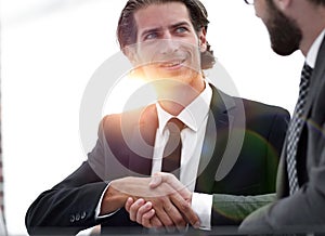 Confident handshake colleagues in the office