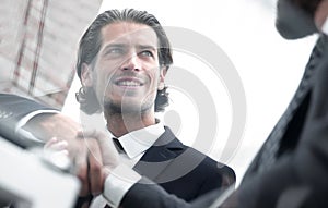 Confident handshake colleagues in the office