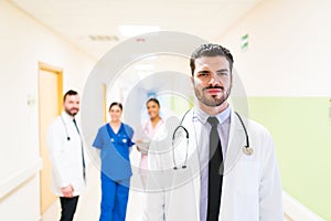 Confident Handsome Mid Adult Doctor At Hospital